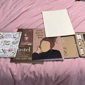 Coloring books, art supplies, drawing paper
